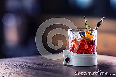 Fresh cocktail drink with ice fruit and herb decoration. Alcoholic, non-alcoholic drink-beverage at the bar counter in the pub. Stock Photo