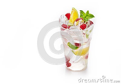 Fresh cold lemonade with soda, ice cubes, mint, lime and raspberry on white background Stock Photo