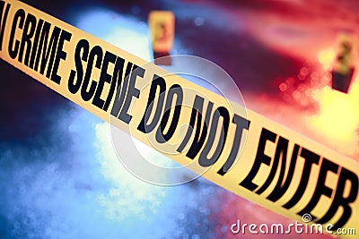 Fresh crime scene with yellow tape at night Stock Photo