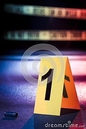 Fresh crime scene with yellow tape at night Stock Photo