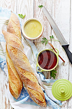 Fresh crispy French baguette with chicken liver pate and berry marmalade on a white aged background. Stock Photo