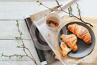 Fresh croissants and a cup of tea for the breakfast. Bright mood flatlay Stock Photo