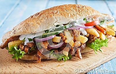 Fresh crusty baguette with BBQ beef and vegetables Stock Photo