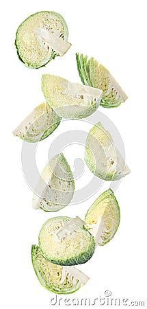 Fresh cut Savoy cabbages falling on background Stock Photo