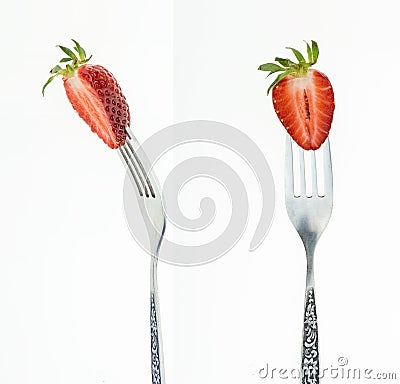 Fresh cut strawberry on fork, front and side view, on white Stock Photo