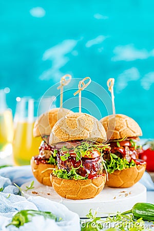 Fresh delicious burgers in Form of Football soccer, Stock Photo