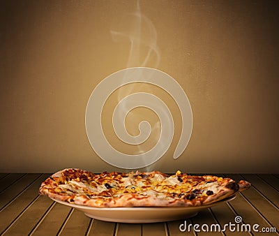 Fresh delicious home cooked pizza with steam Stock Photo