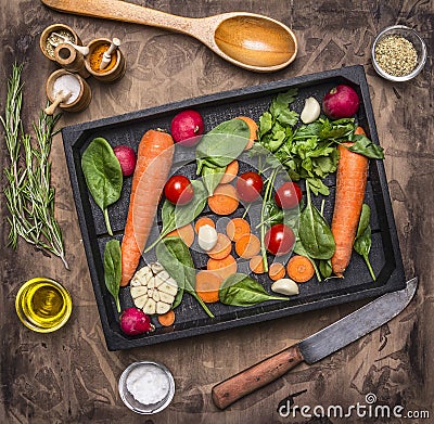 Fresh delicious ingredients for healthy cooking or salad making on rustic background, top view Diet or vegetarian food concept Stock Photo