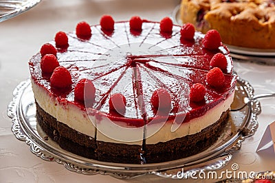 Fresh dessert fruit cake covered in raspberries ( Snowwhite cake Stock Photo