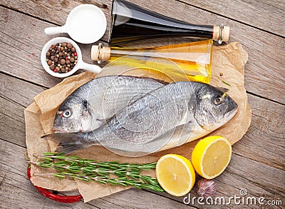 Fresh dorado fish cooking with spices and condiments Stock Photo