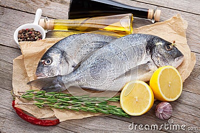 Fresh dorado fish cooking with spices and condiments Stock Photo