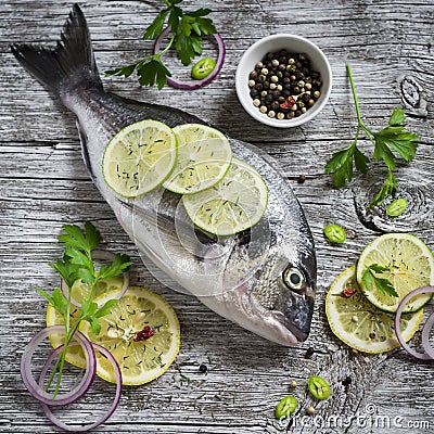 Fresh Dorado fish, lemon, lime and parsley Stock Photo