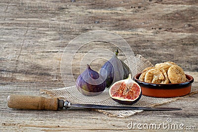 Fresh and dried figs on wood Stock Photo