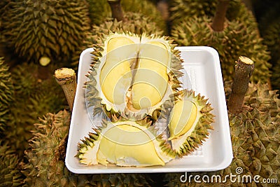 Fresh durian peeled on tray and ripe durian tropical fruit Stock Photo