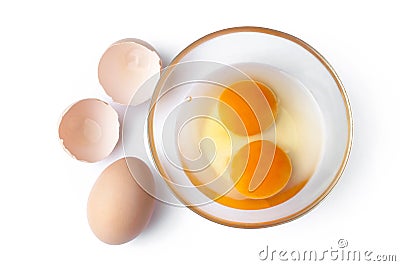 Fresh egg and egg york in bowl. Top view. Cooking dishes from chicken eggs Stock Photo