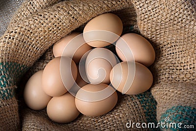 Fresh eggs from a farm in a bag. Top view. Crude products Stock Photo