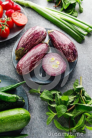 Fresh Fairy Tale kind eggplant and different vegetables Stock Photo