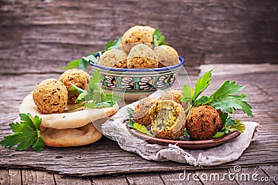 Fresh falafel balls served on a wooden board Stock Photo