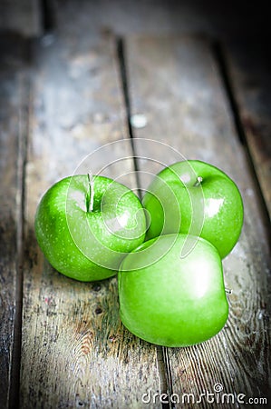 Fresh farm raised apples on rustic wooden background Stock Photo