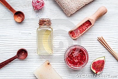 Fresh fig for organic scrub and oil in cosmetic spa set on white wooden background flat lay Stock Photo