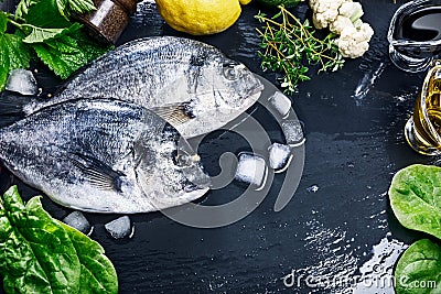 Fresh fish dorado top view spicy herb Stock Photo