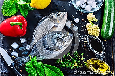 Fresh fish dorado top view spicy herb Stock Photo