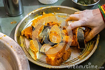 fresh fish marinating in spices at home in plat from different angle Stock Photo