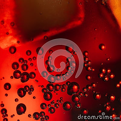 Fresh fizzy coke with bubbles and ice cubes background. Bubbly soda pop drink closeup Stock Photo