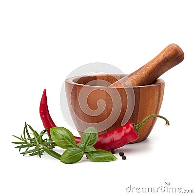 Fresh flavoring herbs and spices in wooden mortar Stock Photo