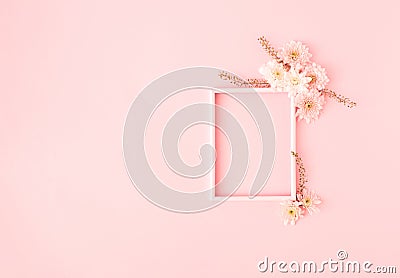 Fresh flowers composition and frame on pastel pink background. Minimal spring or summer concept. Wedding day or romantic Stock Photo