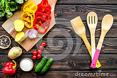 Fresh food ingredients for vegetarian kitchen on wooden background top view Stock Photo