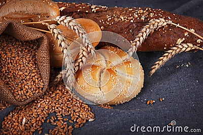 Fresh fragrant bread on the table. Food concept. Bakery, crusty loaves of bread and buns. Assortment of baked bread Stock Photo