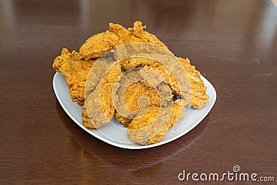 Fresh Fried Chicken on Shiny Table Stock Photo