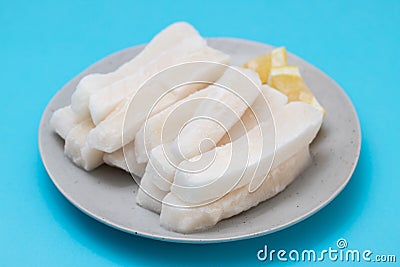 Fresh frozen squid on plate Stock Photo