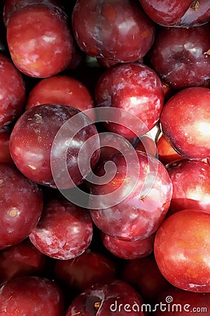 fresh fruit blue plums a close up in a box, a box a background in the market Stock Photo