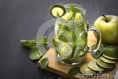 Fresh fruit Flavored infused water mix of Apple, lime and basil Stock Photo