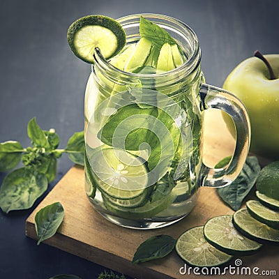 Fresh fruit Flavored infused water mix of Apple, lime and basil Stock Photo