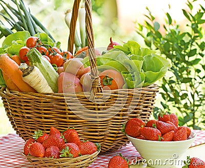 Fresh fruit i vegetables in wicker basket Stock Photo