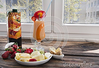 Fresh fruit juice and fresh fruits mix, staying healthy in quarantine Stock Photo
