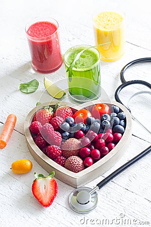 Fresh fruits vegetables and heart shape with stethoscope health diet concept Stock Photo