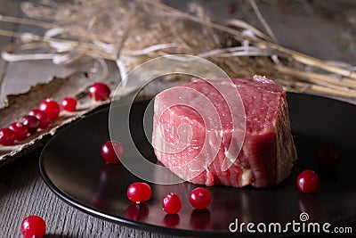 Fresh game meat on a wooden table Stock Photo