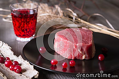 Fresh game meat on a wooden table Stock Photo