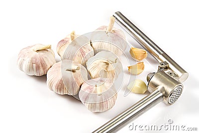 Fresh Garlic isolated on white background close-up. Fresh garlic with metal garlic extruder, press Stock Photo