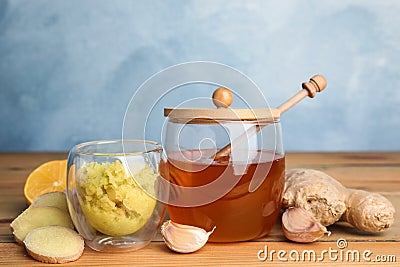 Fresh garlic and other natural cold remedies on wooden table Stock Photo