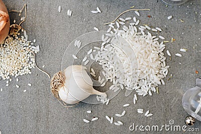 Fresh Garlic on Table with Rice . Closeup Photo. Healthy Food Spicy Cooking Stock Photo