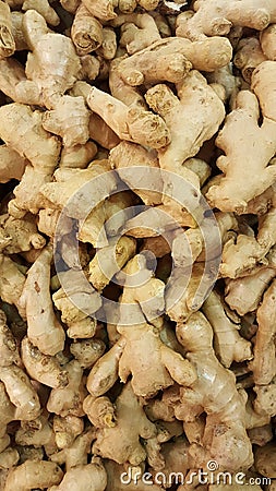 Fresh ginger rhizome background overhead. Root Stock Photo