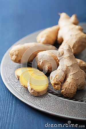 Fresh ginger on vintage plate Stock Photo