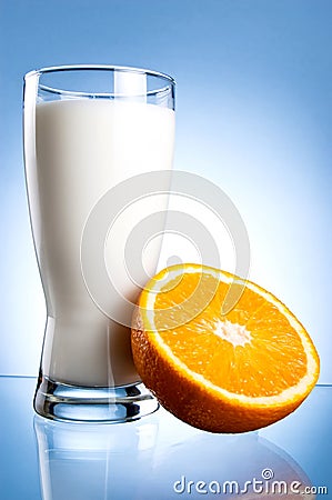 Fresh Glass of Milk and Half of juicy orange Stock Photo