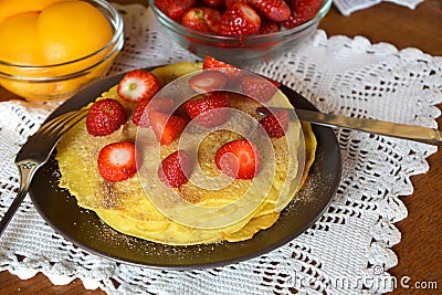 Fresh gluten free pancakes with strawberries and cinnamon sugar. Stock Photo