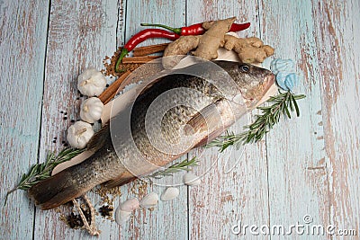 Fresh Golden Snapper on wooden table. Stock Photo